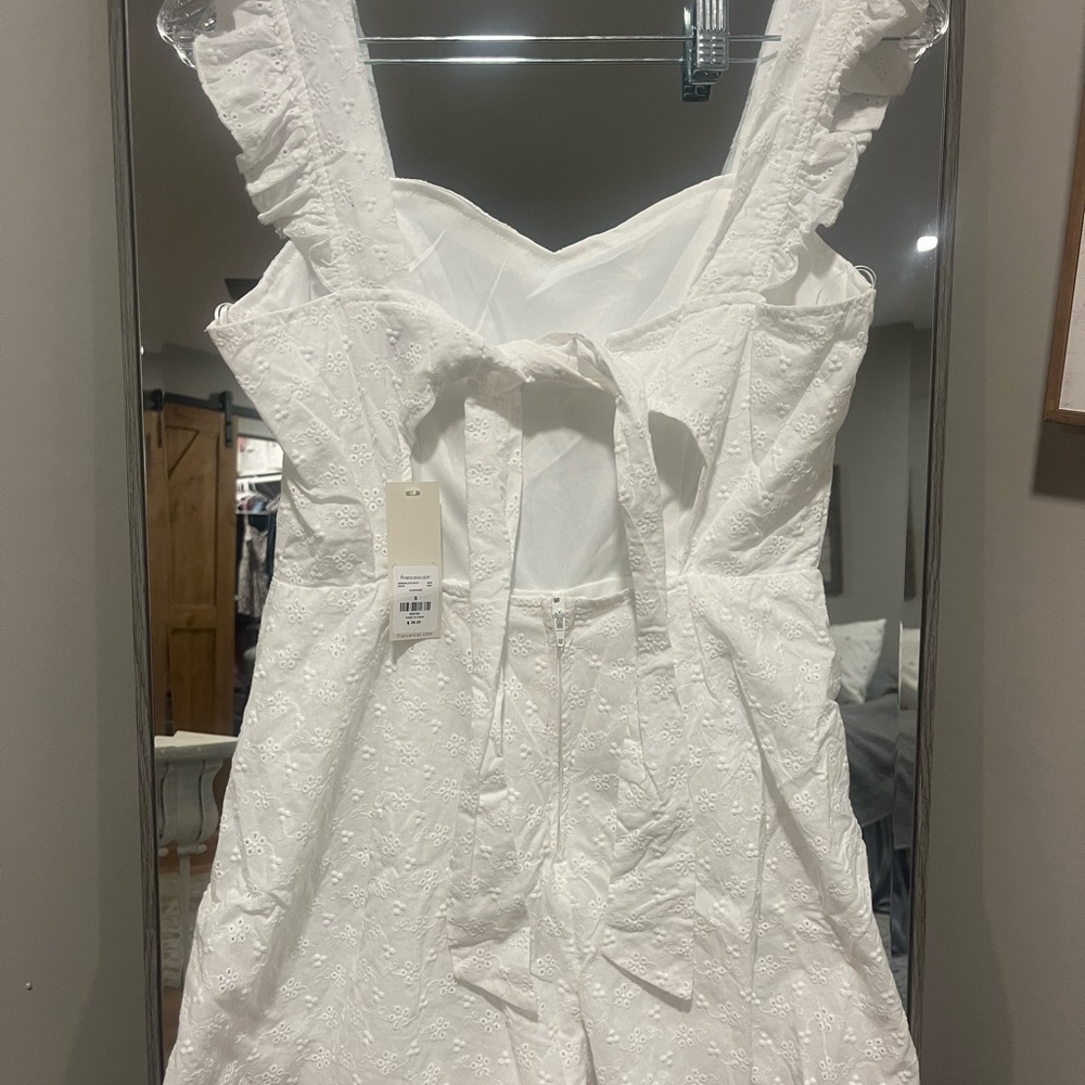 NWT Francesca’s Small White romper.